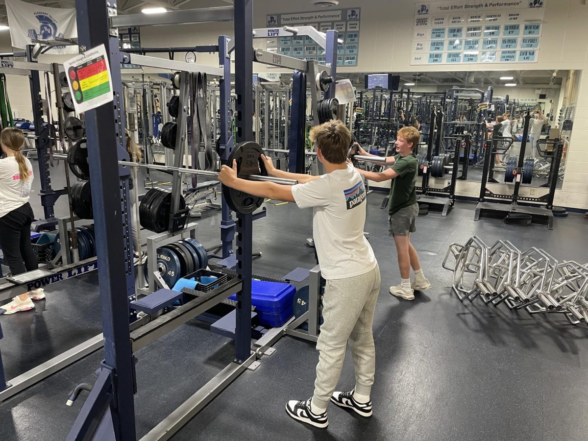 Freshman Brewer Perkins and Brady Averill lifting during their Basic Weight Training and Conditioning class.