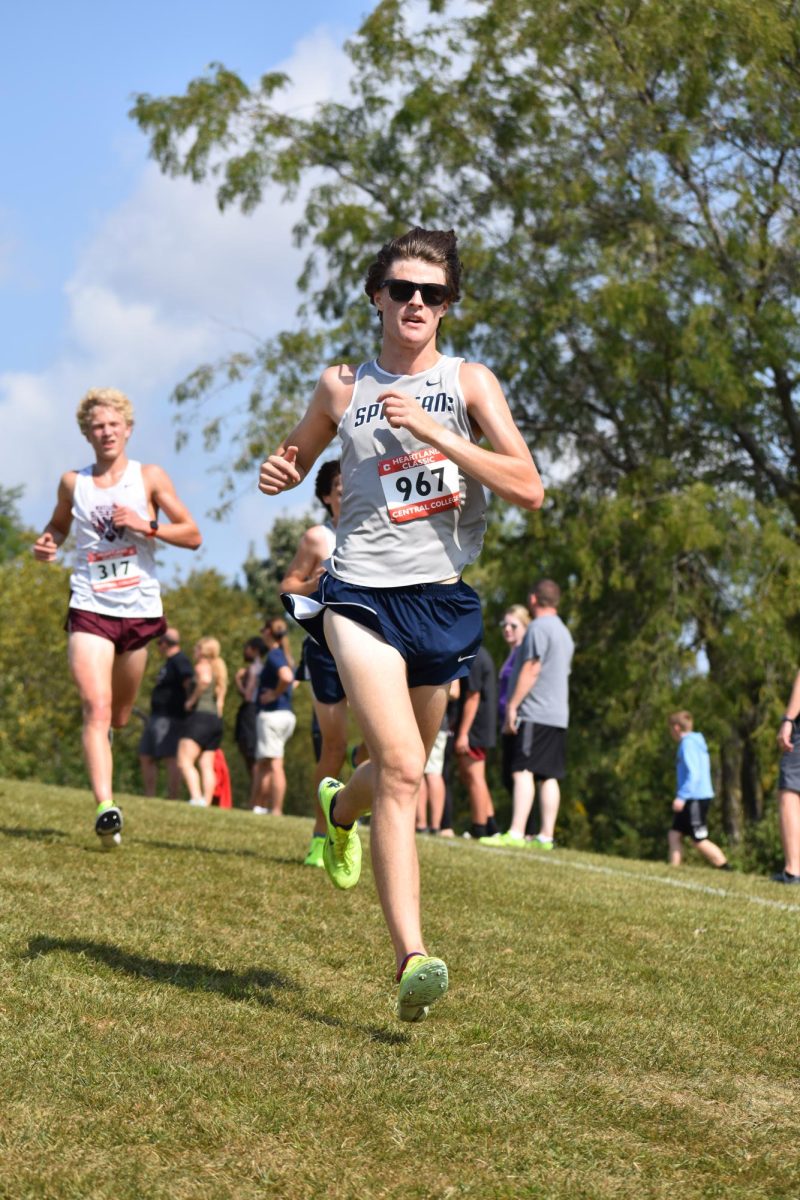  Max Sorgenfrey kicks it into high gear at the end of a cross country race.