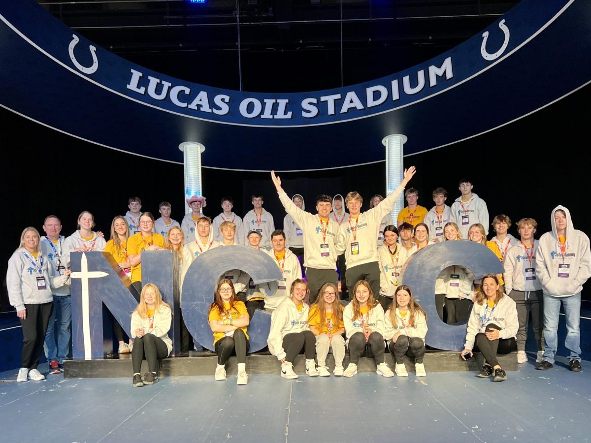 St. John Vianney group poses for a photo as NCYC in Lucas Oil Stadium on Nov 18, 2023. Photo credit to Kevin Kwak.