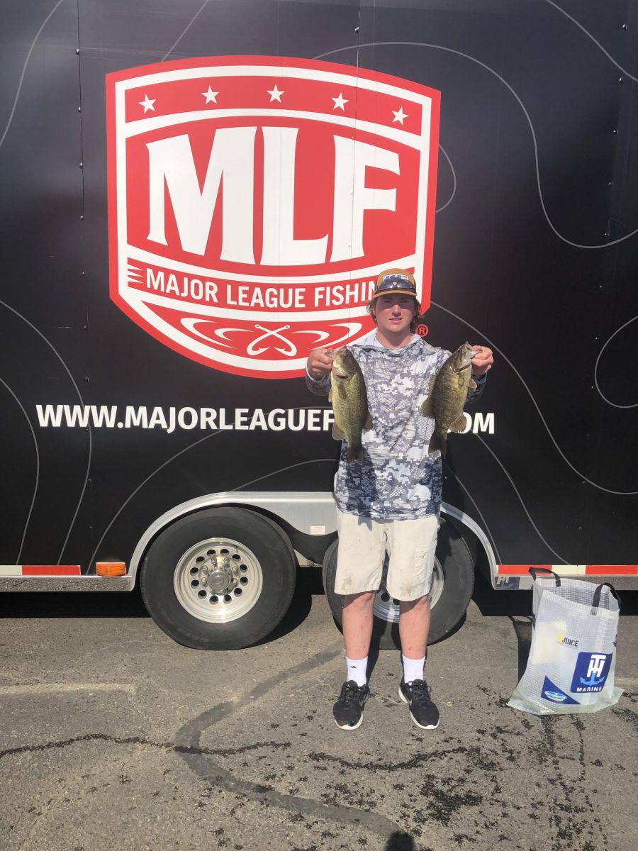 Owen Stoltz holds up his best fish after a Major League Fishing Bass Fishing League tournament.