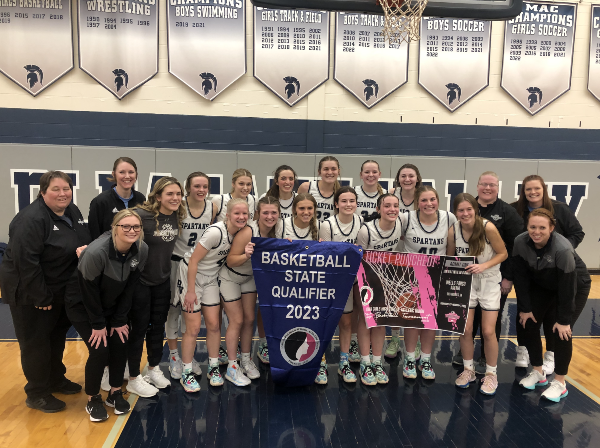 The+Pleasant+Valley+Girls+Basketball+team+poses+after+winning+their+Regional+Final+game+against+Dubuque+Senior+Feb.+21%2C+2023.+Photo+credit+to%3A+Missy+Clemons