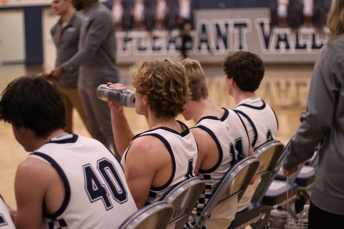 Seniors Max Muszalski, Caden Rubel, David Gorsline and Coy Kipper (left to right) rest up before heading into the second half vs. Assumption. Photo credit to Spartan Shield staff.