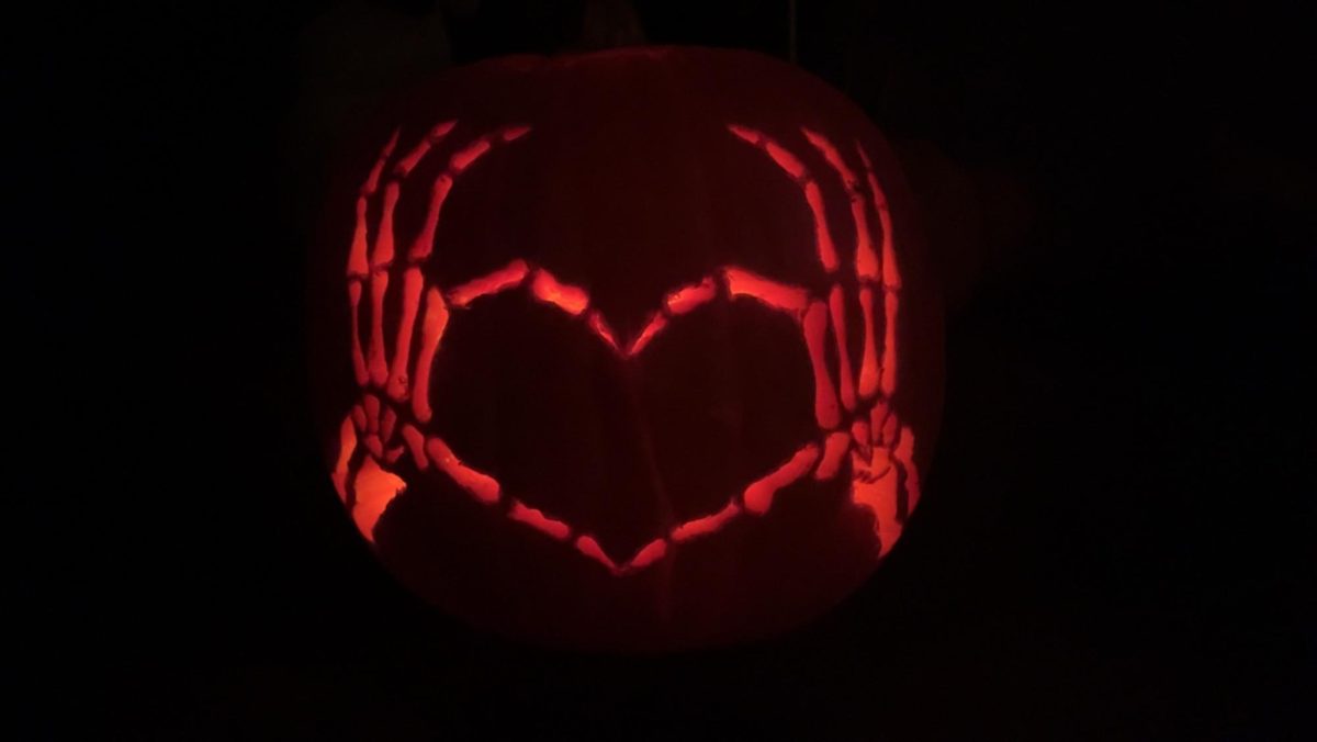 A pumpkin carved under the supervision and with the help of Melisa Book.