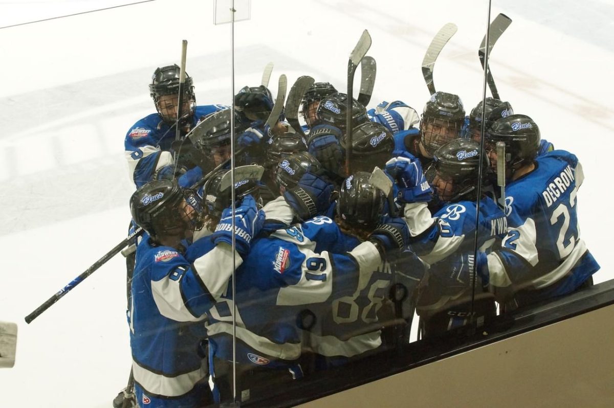 The Quad City Blues hockey team celebrate a big win after senior Alex Blunk scores the game winning goal in overtime against Mason City (12/09/23).

