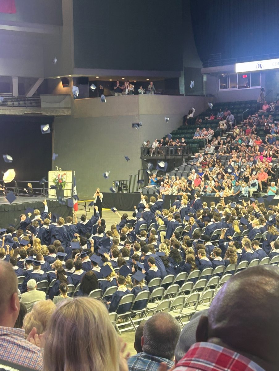 Seniors throw their graduation caps on graduation day on May 28, 2023. 
