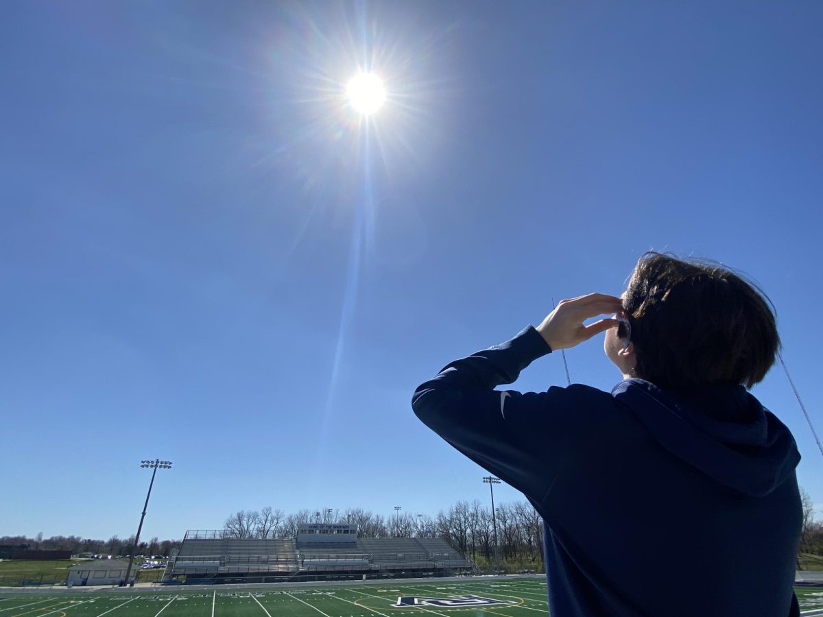 PV senior Matthew Pischke uses solar eclipse glasses to view the astronomical phenomenon.
