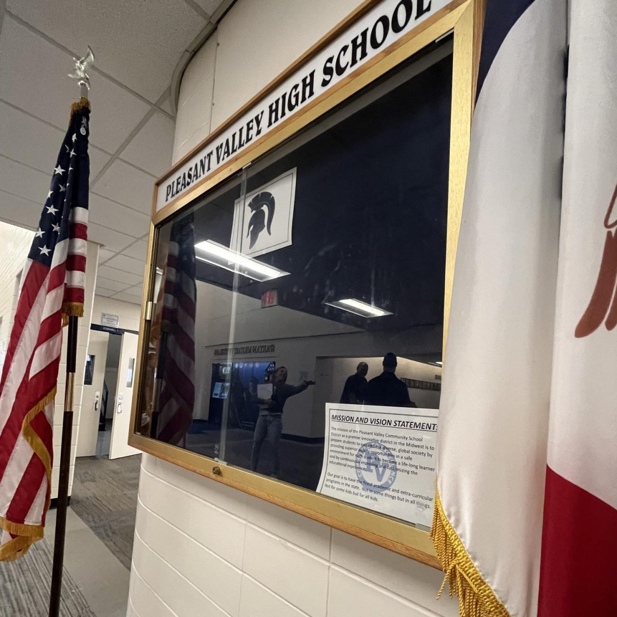 Pleasant Valley's mission statement hangs in the emptying hallway. As the last bell of the school year rings, students are still unsure of their schedules for the upcoming semester.