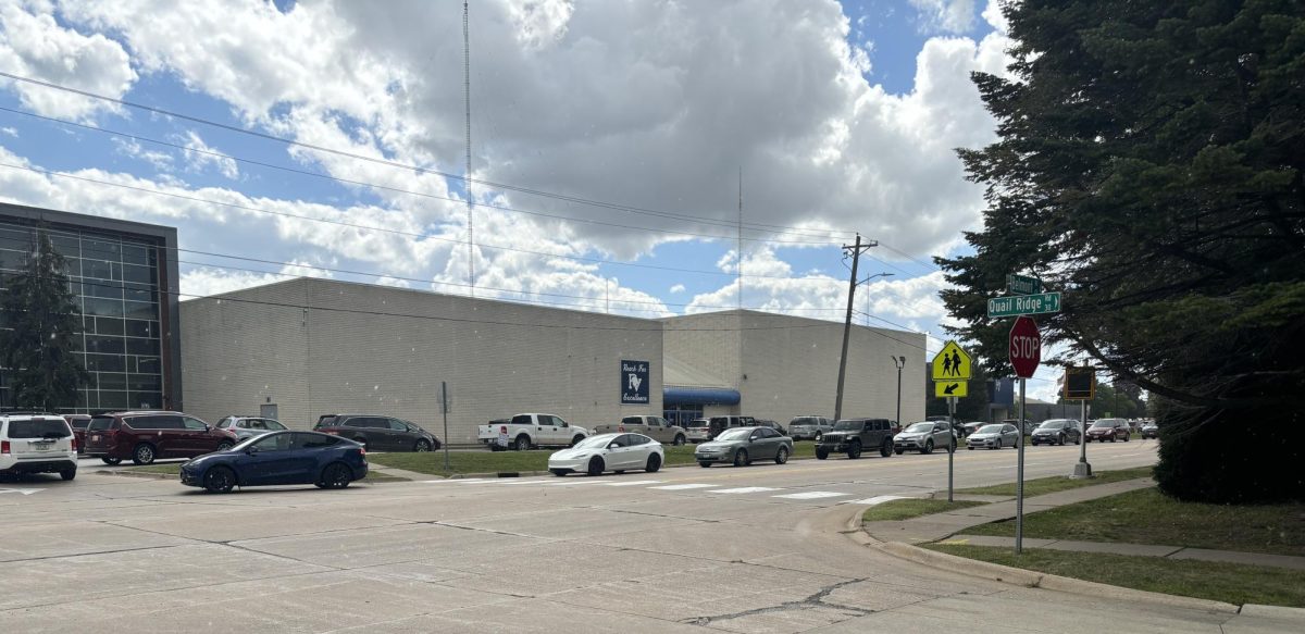 Lines of cars sitting in front of PVHS waiting to pick students up, creating unnecessary traffic congestion and frustrations amongst drivers stuck in line.