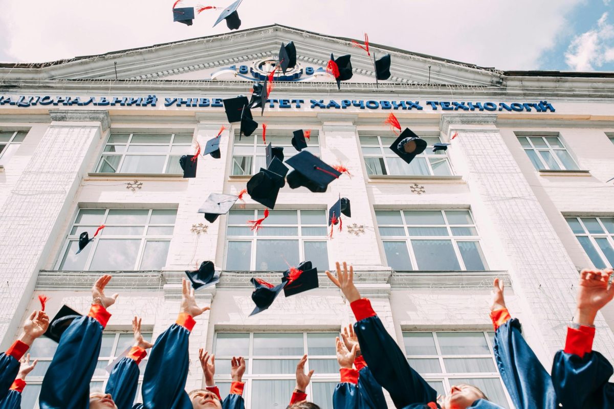 People throwing their hats off after graduation.

Photo Credit to Vasily Koloda