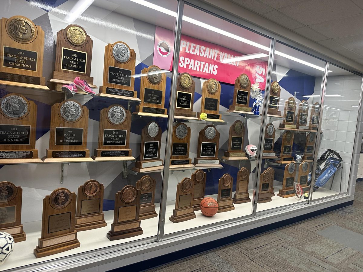 The Pleasant Valley trophy case displaying all of the recent place winner trophies. The trophies demonstrate the hard work put in by past and current Pleasant Valley girls athletes.  