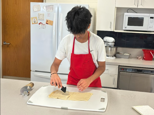 Senior Aayush Deshpande makes cinnamon bread twists during food prep

Photo Credit to Aayush Desphande 
