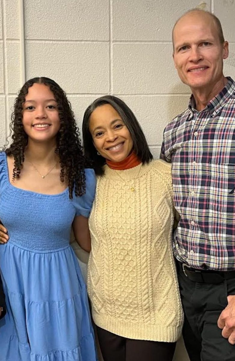 Senior Victoria Rice pictured with her Haitian mom and Norwegian dad, showcasing two different aspects of her identity. Photo credit to Victoria Rice.