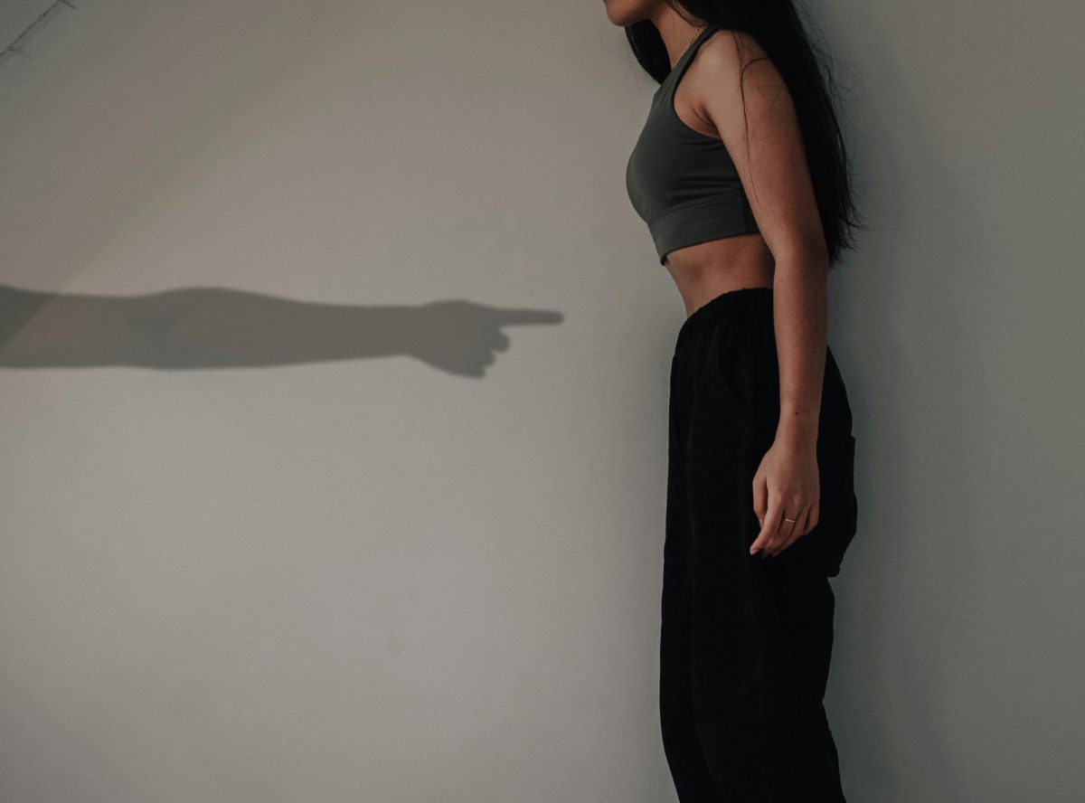 Photo depicting body shaming on Women from an outside perspective symbolized by the pointing finger. 

Photo Credit: Ie. Source: Hannah Xu via Unsplash 
