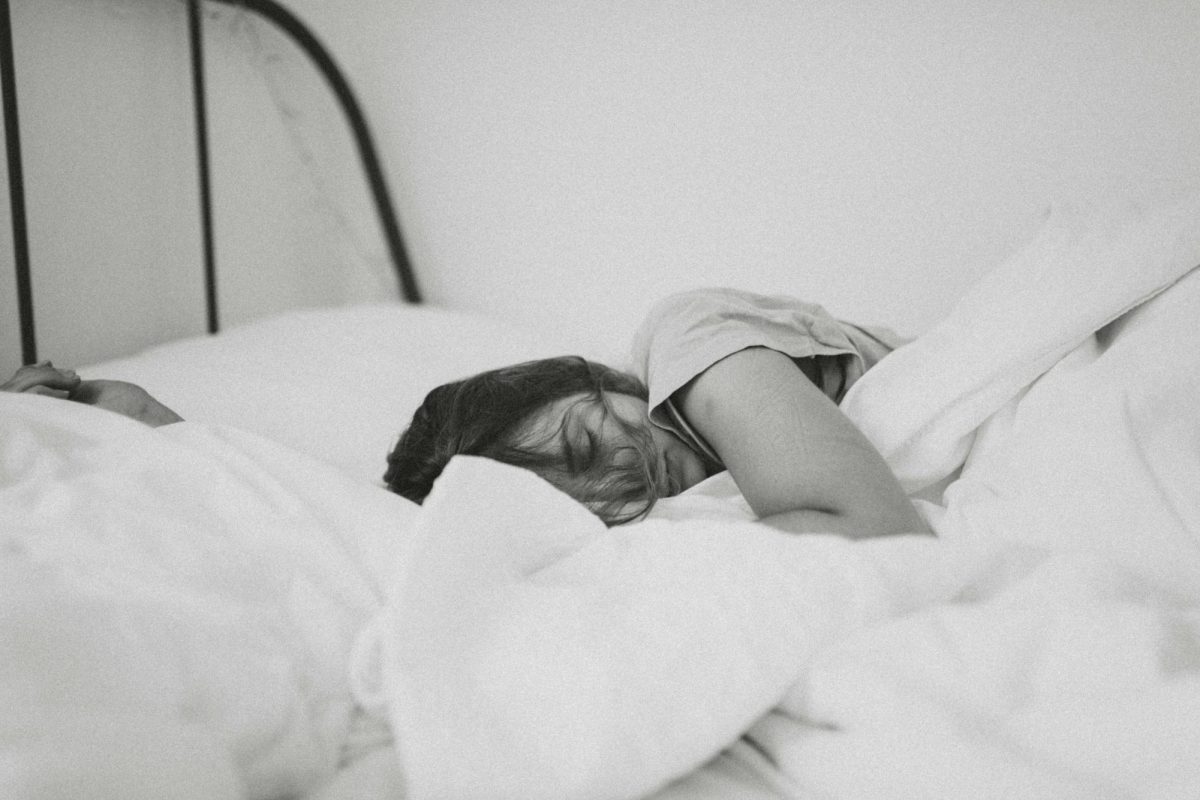 Depicting a woman laying in bed for what seems to be hours. She is portrayed looking burnt out and exhausted.   

Photo Credit: Kinga Howard via Unsplash