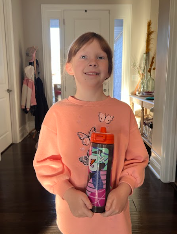 Fourth grader Evie Hoffman with her Mallory Swanson Gx Gatorade bottle. Players on Gatorade’s roster have inspired Hoffman to push herself farther than she thinks she can. 

Photo Credit: Shawna Hoffman