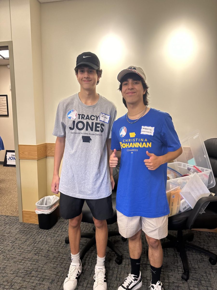 Mau Sanchez Carmona stands next to his brother, Margil Sanchez Carmona before canvassing for congress candidate Christina Bohannan.