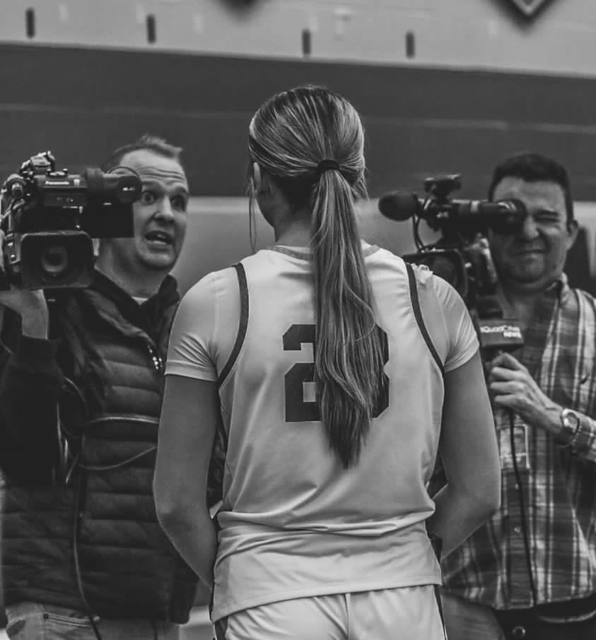 Senior basketball player Quinn Vice completes a press interview after a home win. Photo Credit to Maureen Dyer