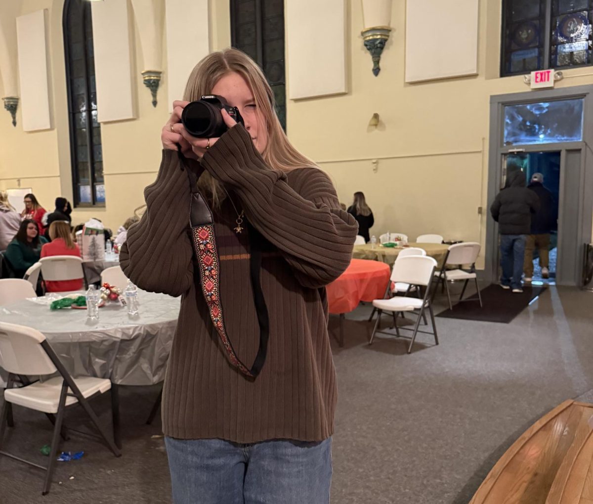 Junior Mia Stocking takes pictures and volunteers at One Eighty’s 2024 Christmas party.

Photo Credit to Jenny Halupnik


