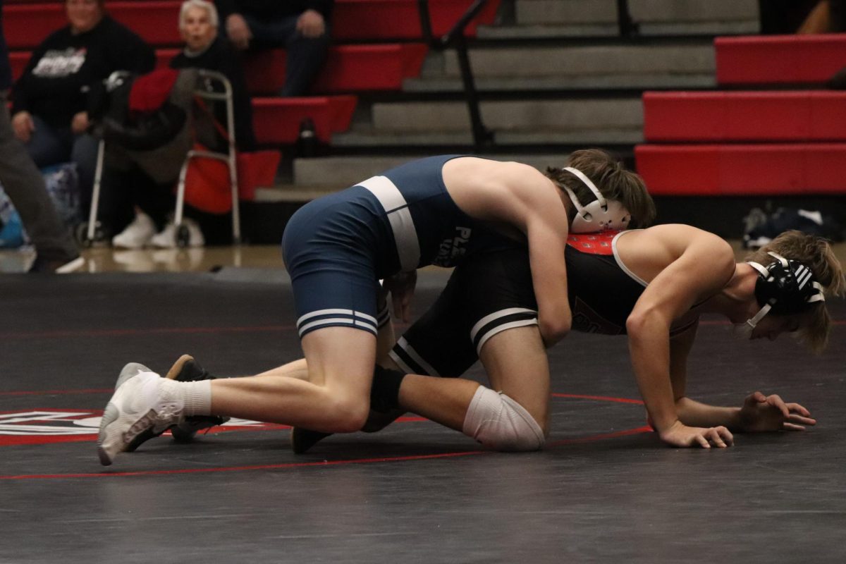 Teddy Swanson puts in a tight waist to keep opponent on the mat, Dec. 19, 2024.