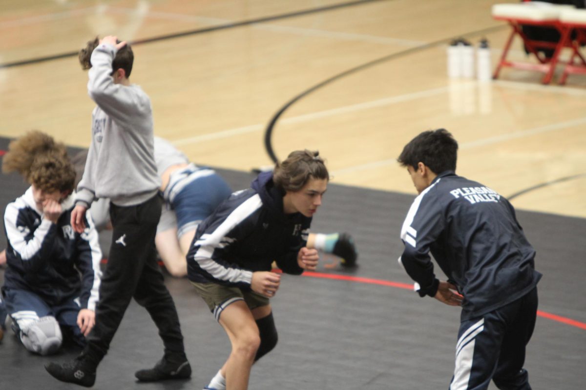 Soren Kelsall and Karson Pulver warming up before the meet, Dec. 19, 2024.