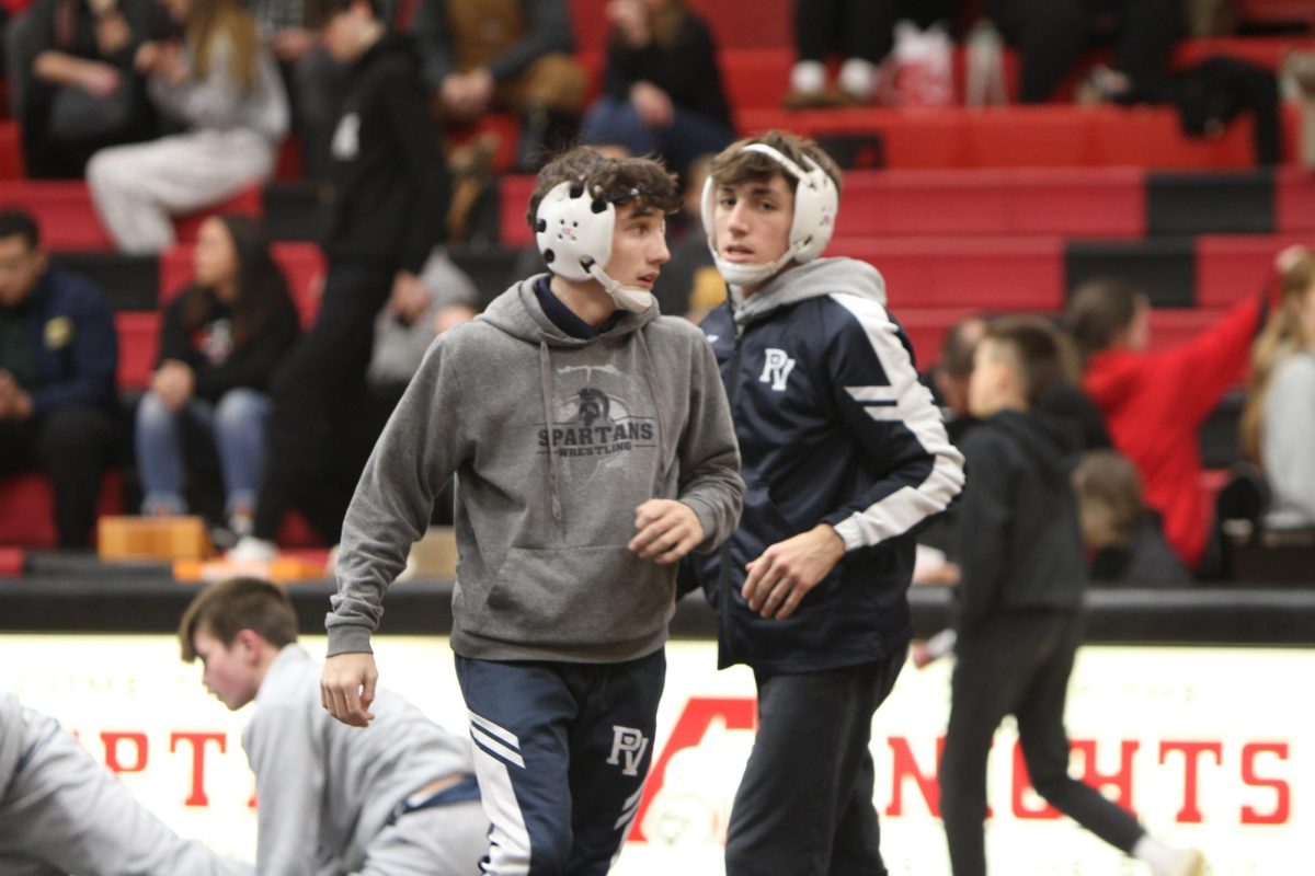 Lucas Reeder and Carter Siebel warming up, Dec. 19, 2024.