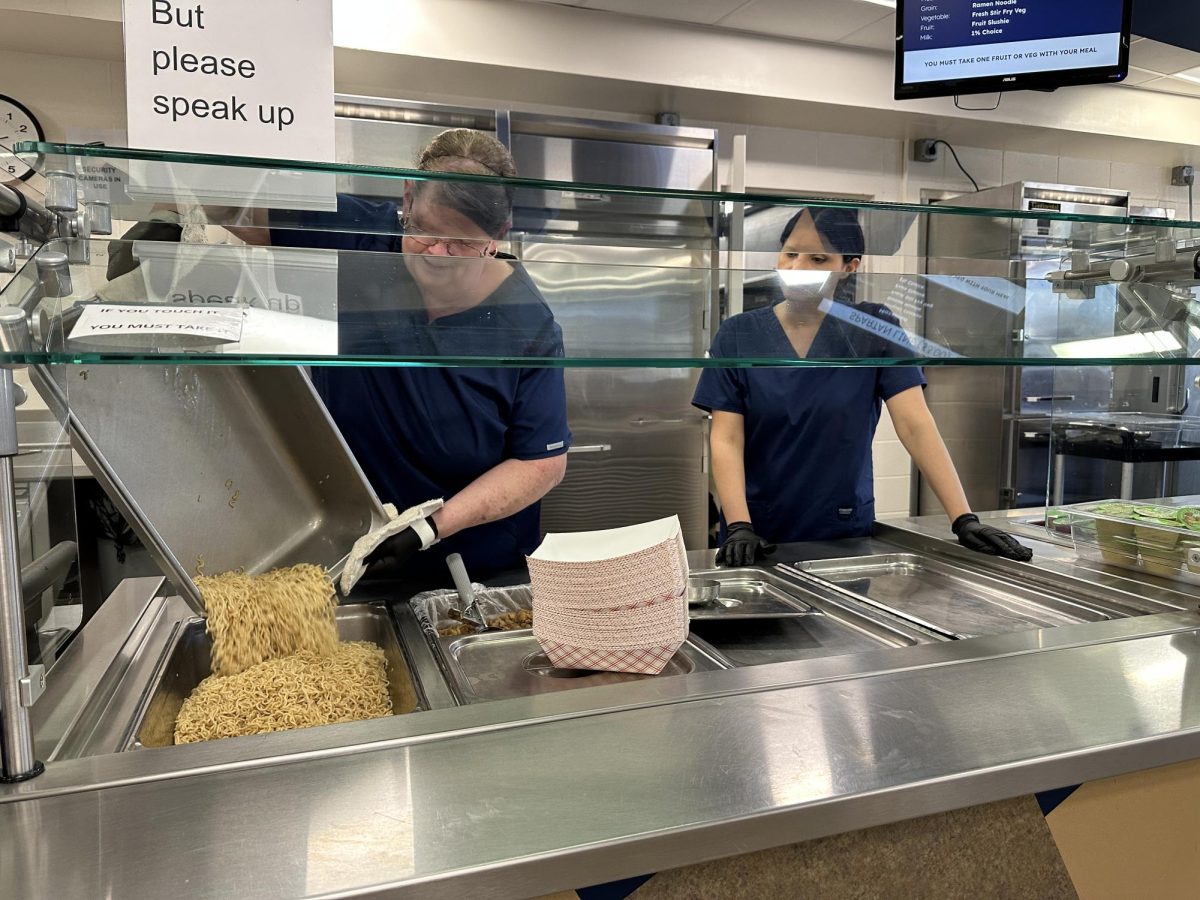 Pleasant Valley High School’s cafeteria staff preparing for lunch, which is extremely stressful with the amount of students entering and exiting the cafeteria. 

