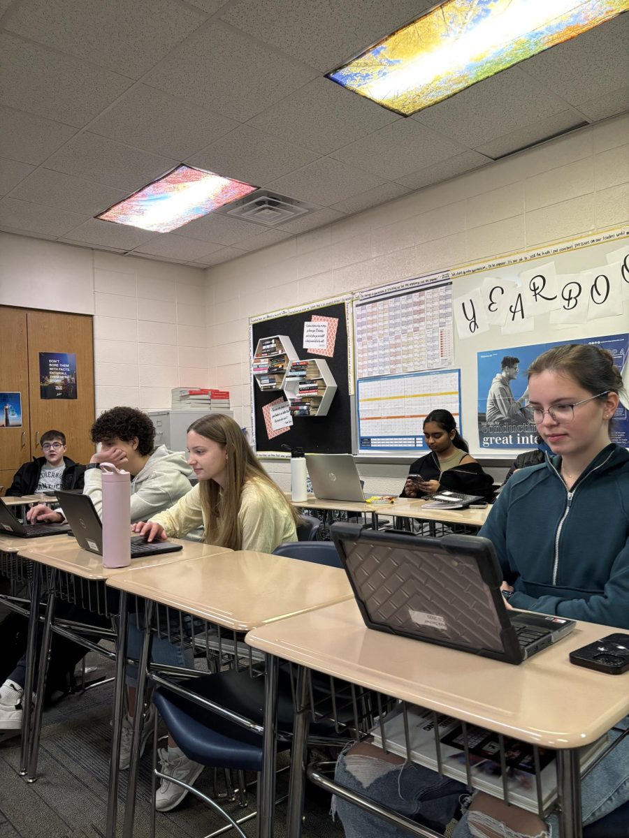 The back row shows one of the many empty seats in a classroom with students out sick at Pleasant Valley High School.