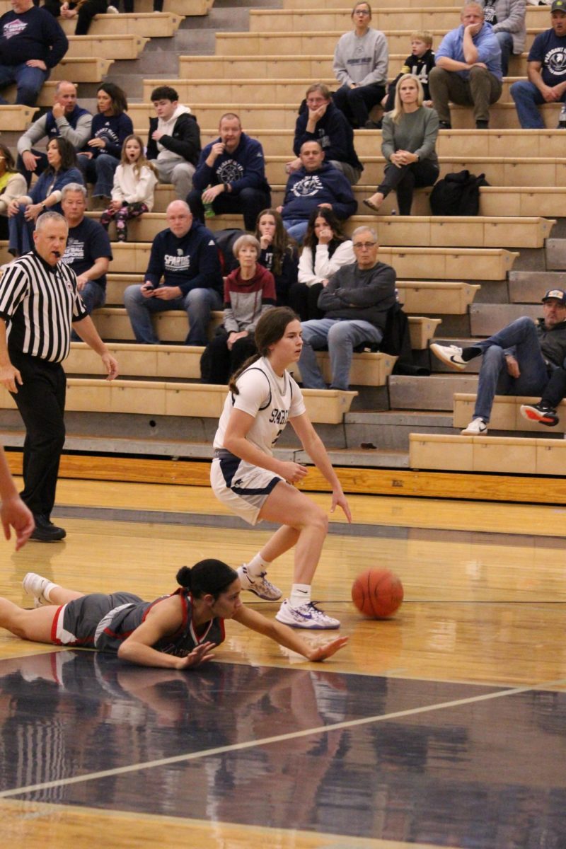 Senior Reagan Pagniano (3) claims the ball after an opposing player trips, Dec. 3, 2024.