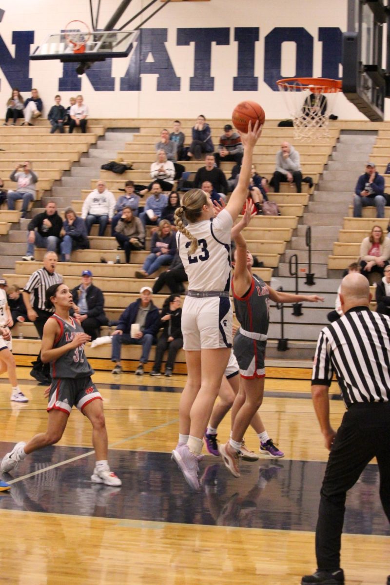 Senior Quinn Vice (23) drives for a layup, Dec. 3, 2024.