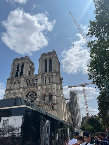 The newly reopened Notre Dame Cathedral glistens with its restored marble and intricate spires. Tourists, like the Treiber family pictured, are eagerly visiting the monument again.

Photo Credit to Estelle Treiber
