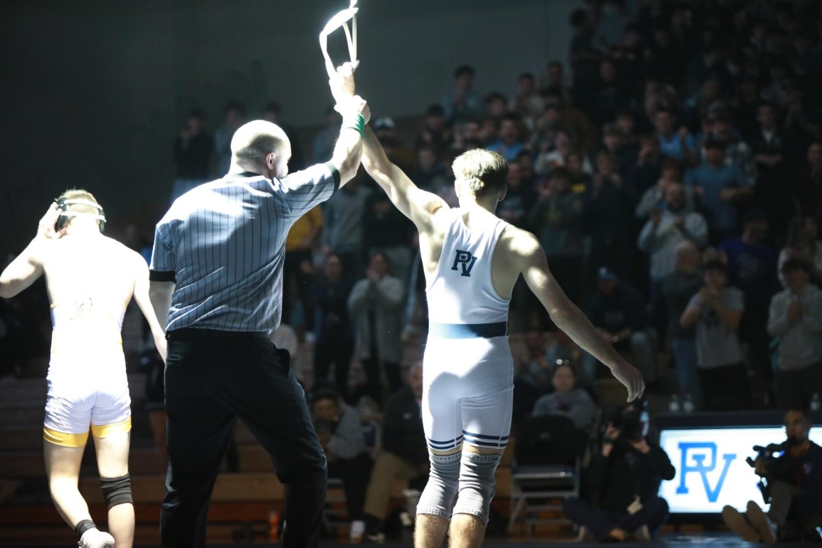 Senior Carter Siebel wins at Boy's Wrestling Qualifiers.