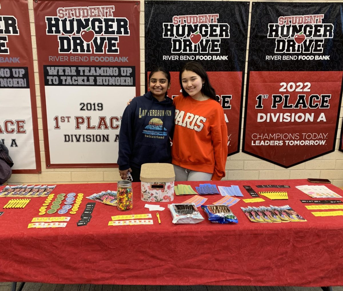 Amnesty Club co-Presidents Swetha Narmeta and Nadia Meeks table before school to raise awareness about immigration rights.