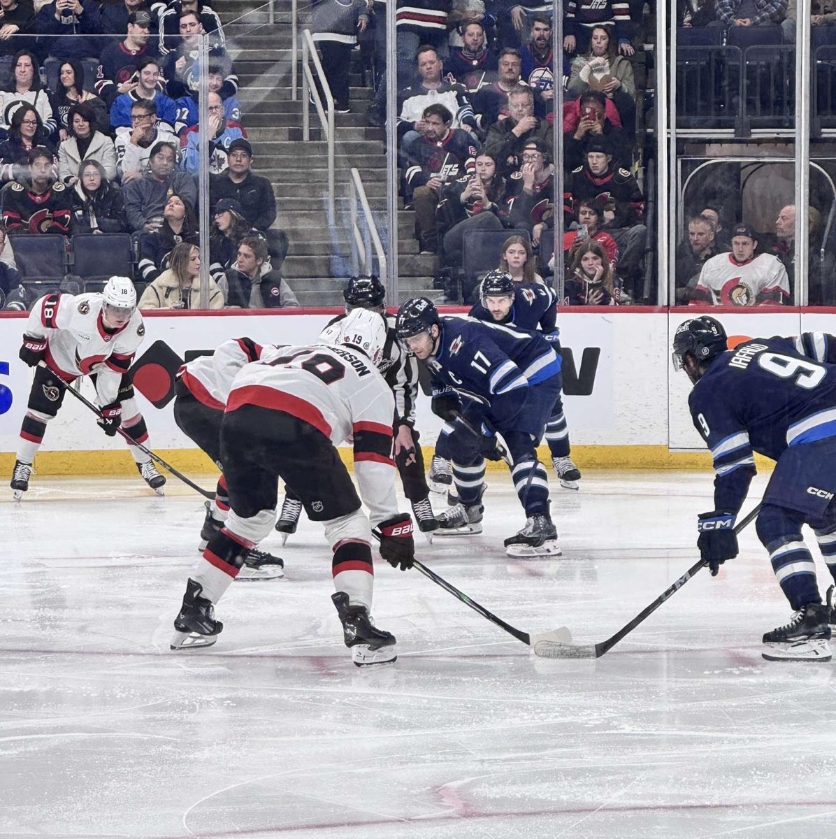 Winnipeg Jets (blue) face the Ottawa Senators (white)
Photo Credit: Maia Katragadda