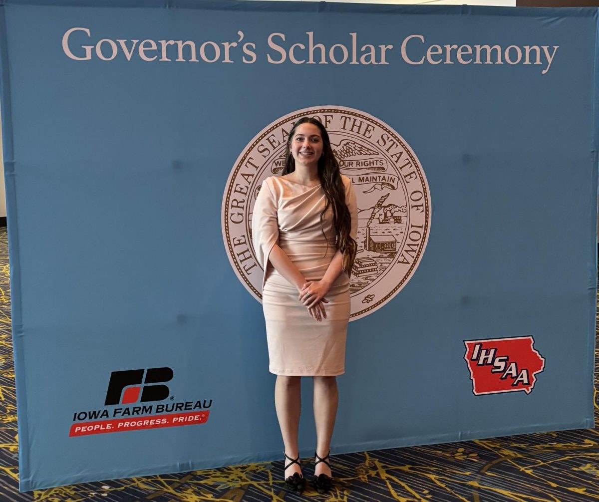 Senior Kira Pielak poses for a picture before receiving her award from the current Governor, Kim Reynolds.
Photo Credit: Kira Pielak