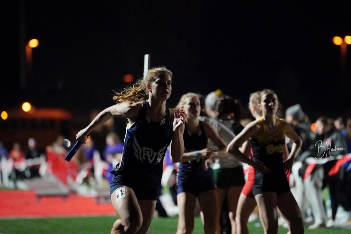 Grace Boleyn is shown running a relay at the Lady Lancer Relays on March 27, 2025. 